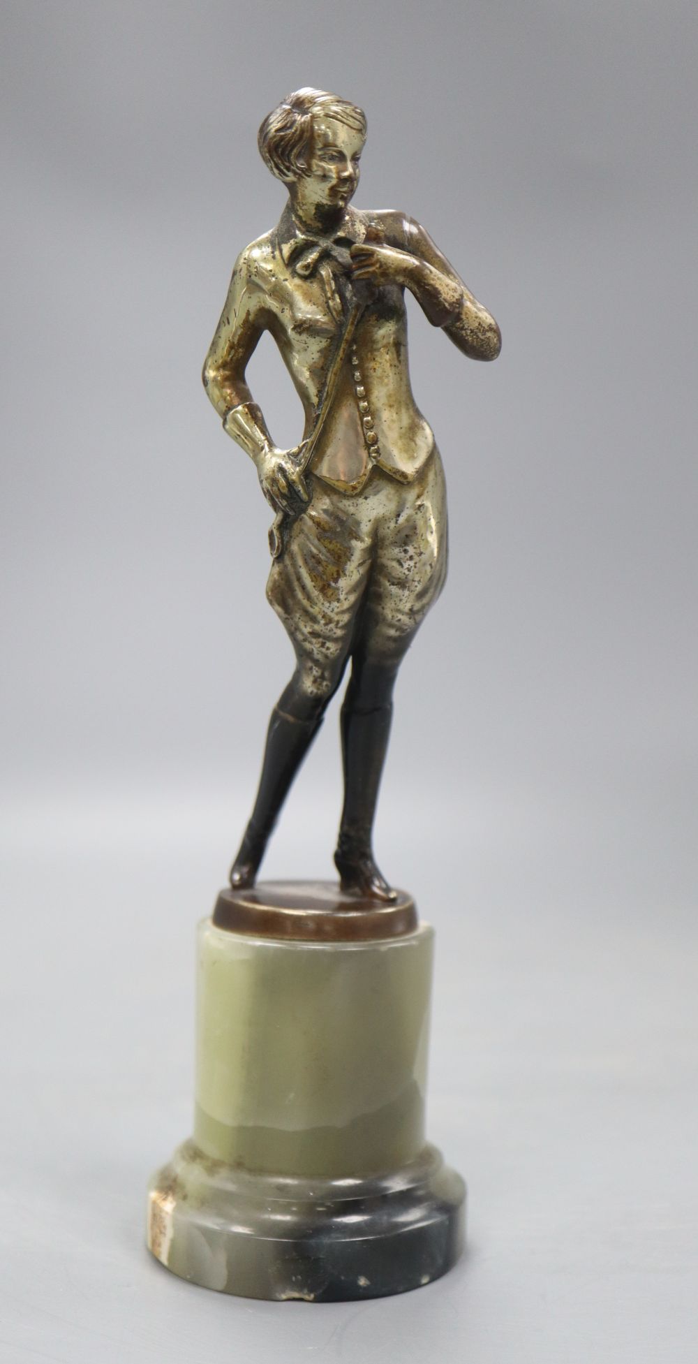 An Art Deco model of a horserider, on onyx base, height 19cm